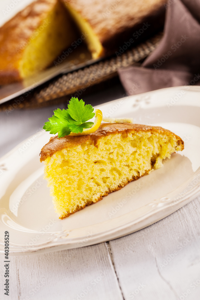 Lemon Sponge Cake on white wooden table Lemon Sponge Cake on white wooden table