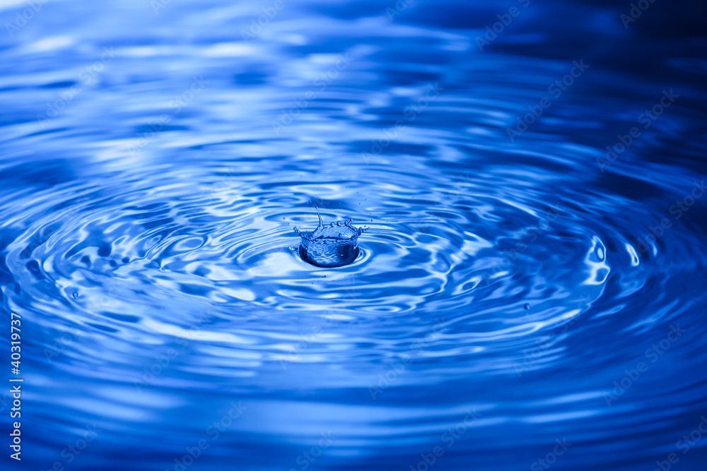 Closeup of water splash in blue tonality