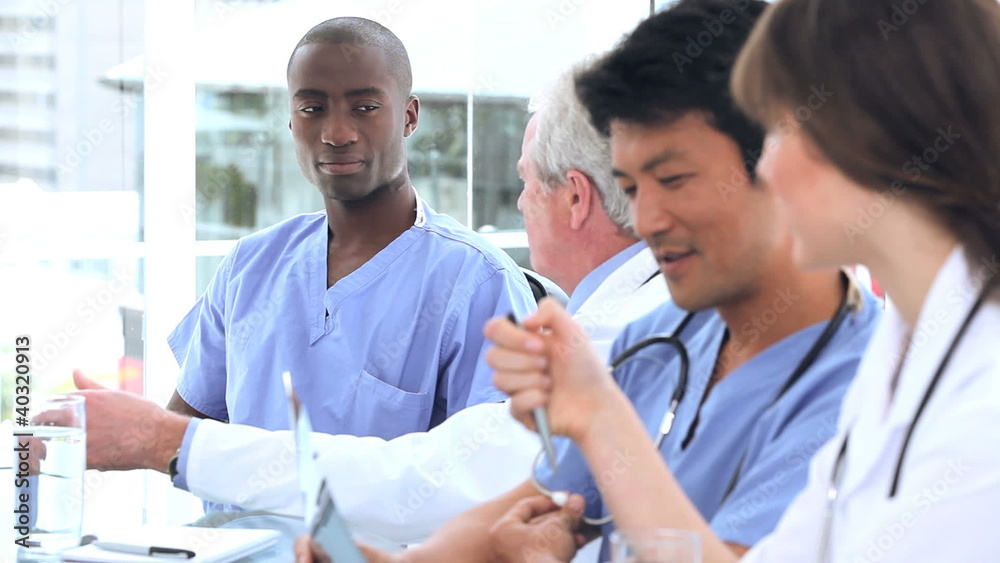 Smiling doctors working together while talking Smiling doctors working together while talking