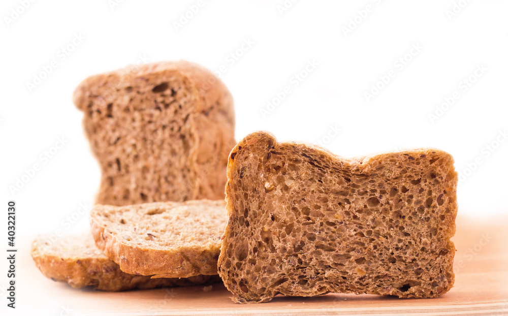 Sliced bread on kitchen board isolated on white background Sliced bread on kitchen board isolated on white background