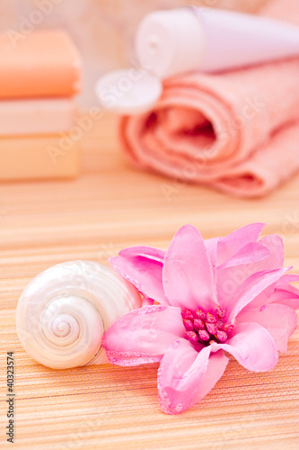 daily spa objects, towel, soaps, lotion, flower