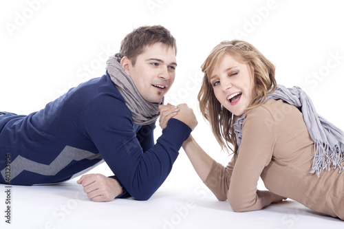 man and woman doing arm wrestling