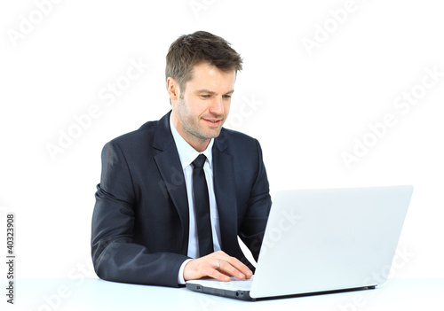 Portrait of young confident business man with laptop