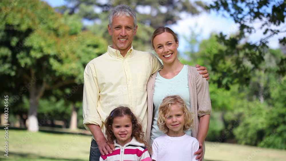 Couple with two children posing Couple with two children posing