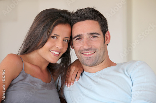 Couple relaxing at home in sofa