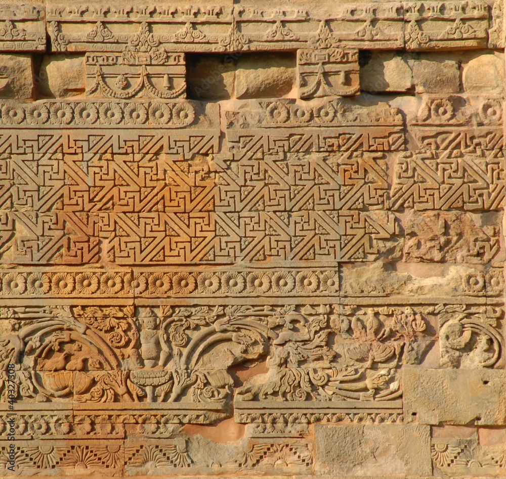 Buddhist carvings on the Stupa at Sarnath