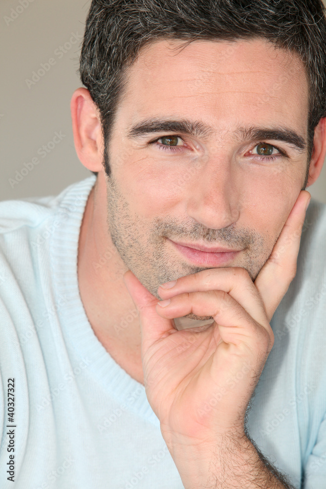 Naklejka premium Portrait of handsome 30-year-old man
