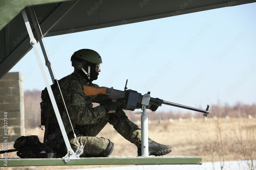 Fototapeta premium Side view of man sitting in helicopter while patrolling