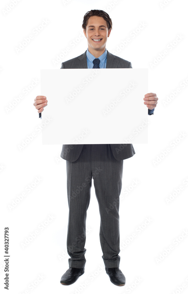 Young businessman holds the blank billboard Young businessman holds the blank billboard