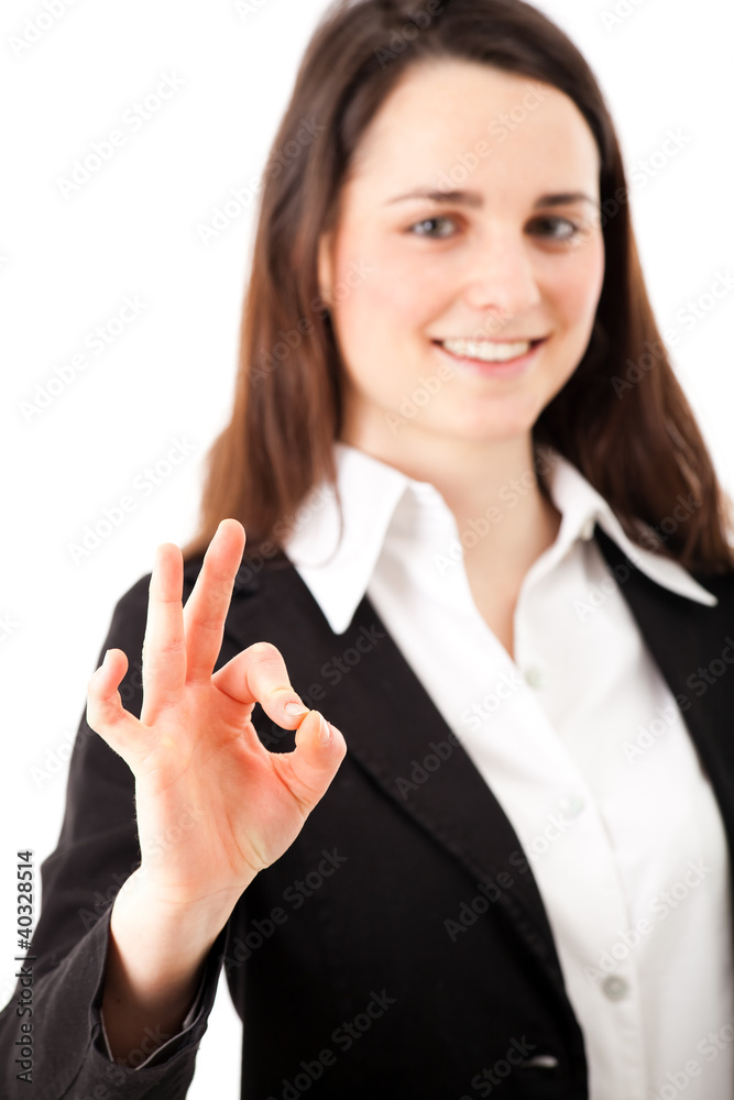 Successful businesswoman doing the ok sign Successful businesswoman doing the ok sign