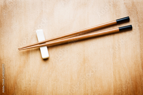 Oriental Chopstick on wooden table photo