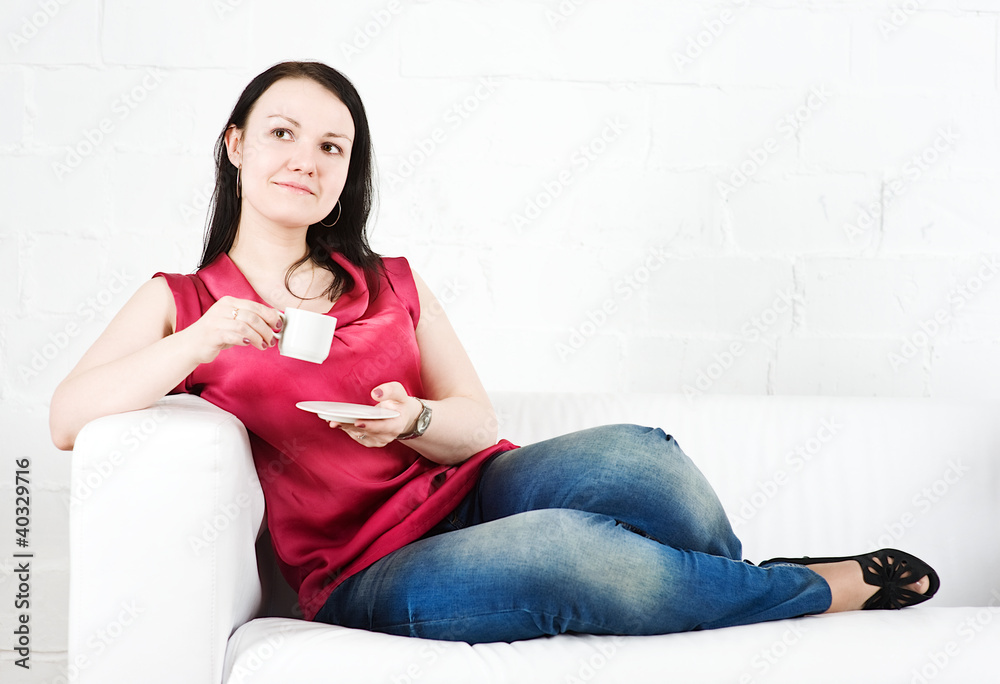 Smiling woman drinking coffee