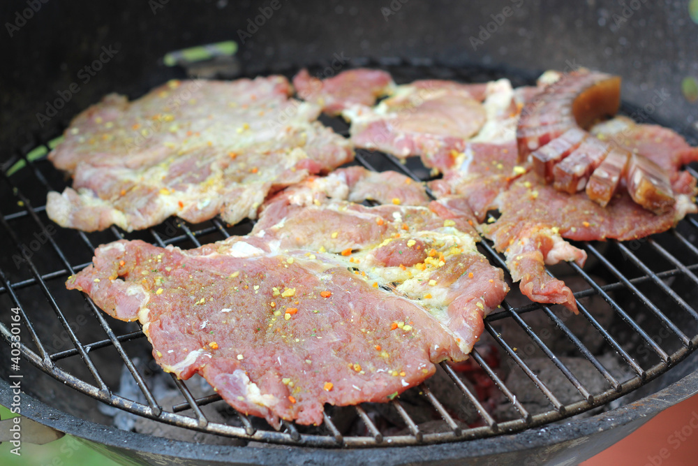 Raw meet on a barbecue