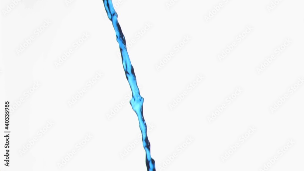 Blue liquid in a super slow motion flowing continuously