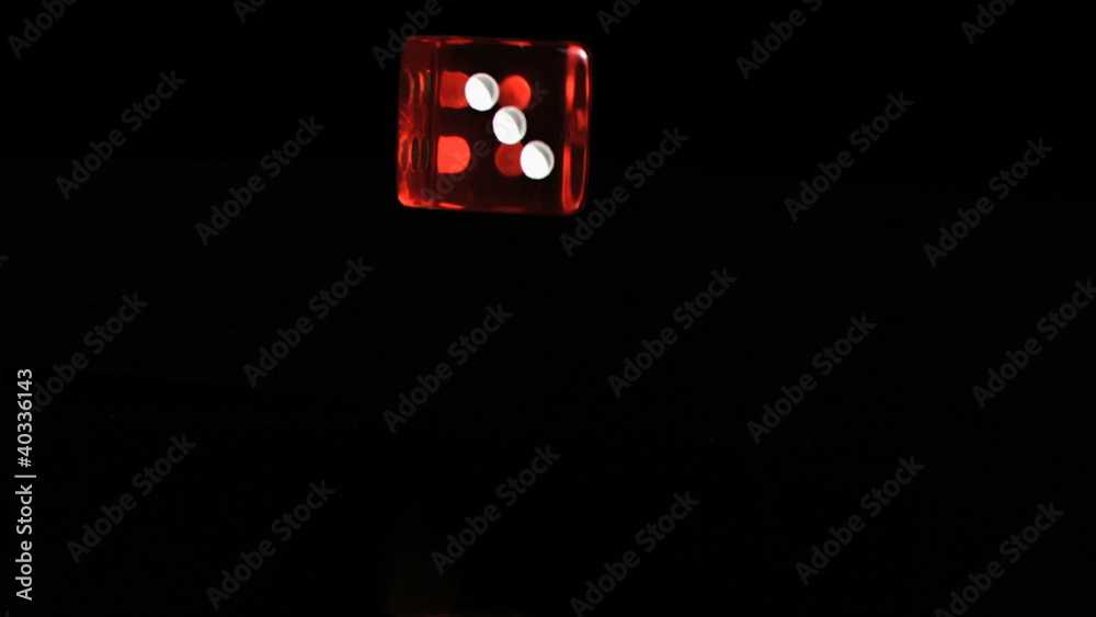 One red dice in a super slow motion rebounding