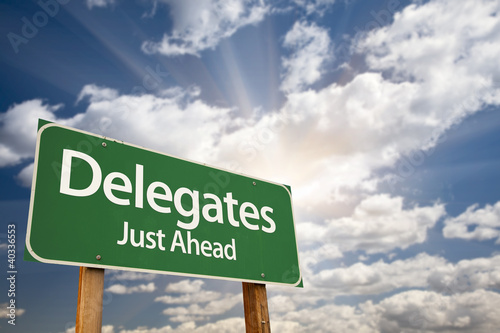 Delegates Green Road Sign and Clouds