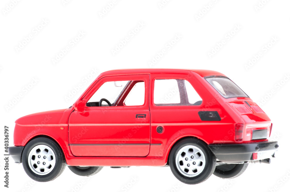 Small red car on white background.