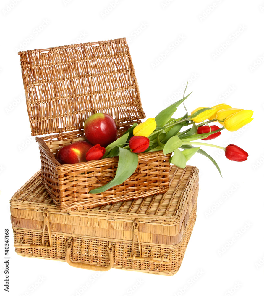 wicker basket of apples and flowers on a white background wicker basket of apples and flowers on a white background