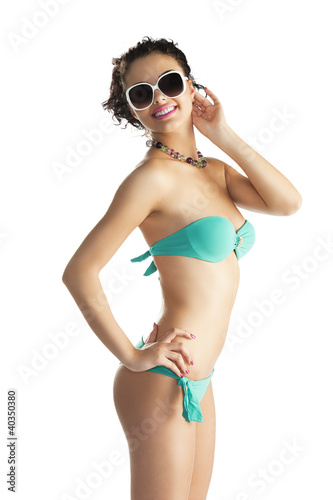 girl in beach wear with sunglasses with body turned in profile © photoCD