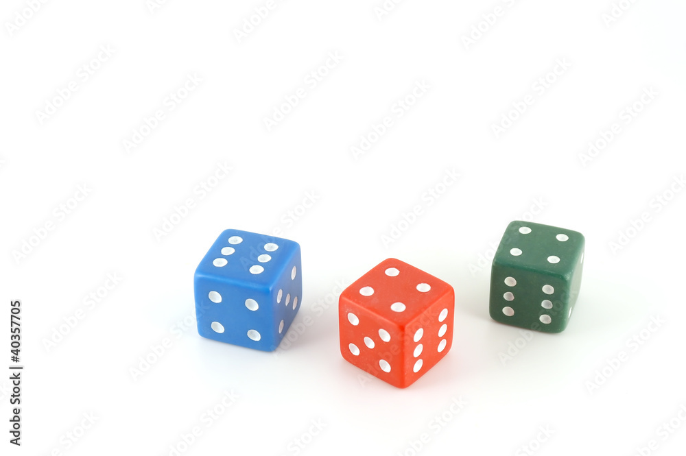 Three color dice over white Three color dice over white