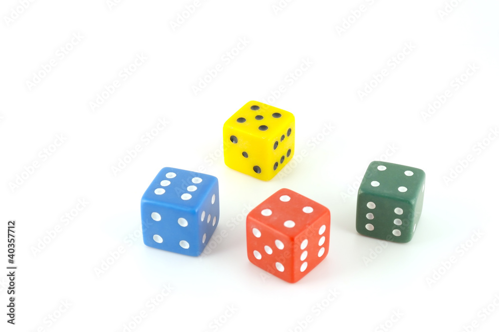 Four color dice over white Four color dice over white