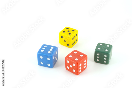 Four color dice over white