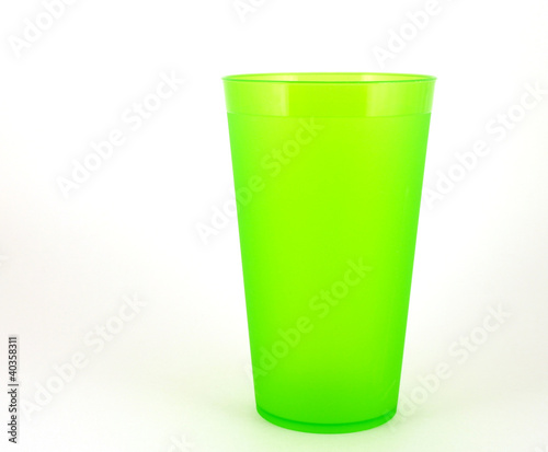 Green plastic cup over white