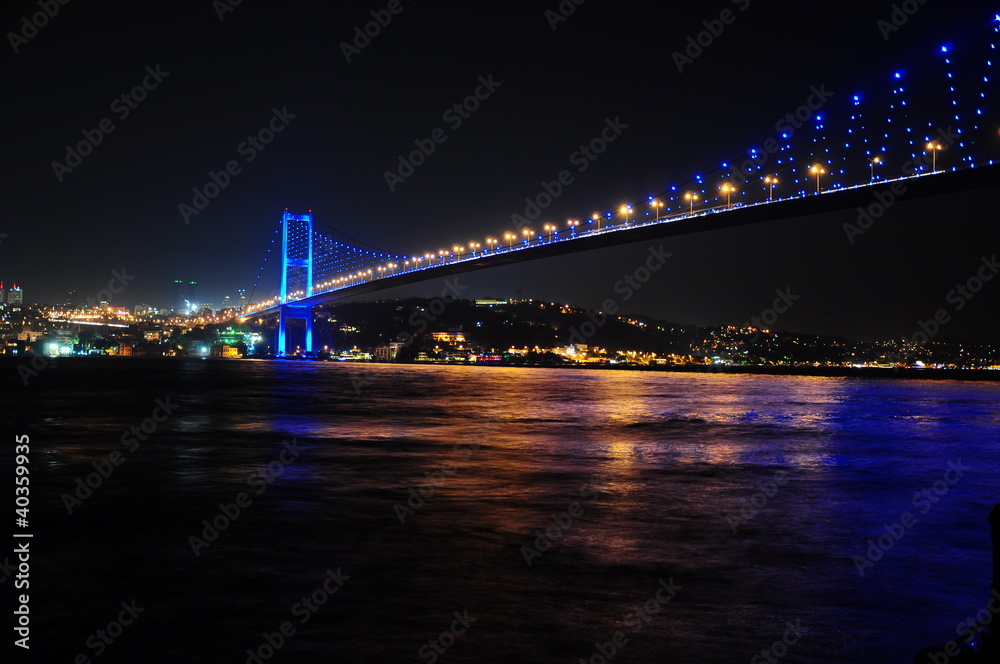 Bosporus Bridge at night with lights in Istanbul, Turkey