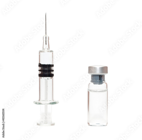 Syringe and vials on white