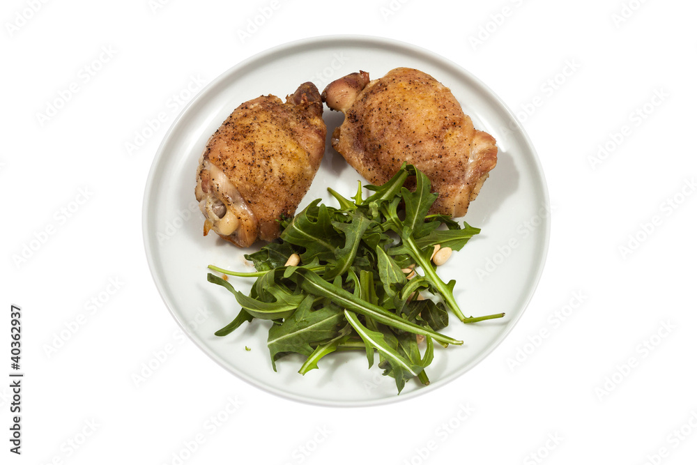 Roast Chicken with rucola on a plate