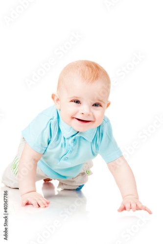 smiling baby crawling forward