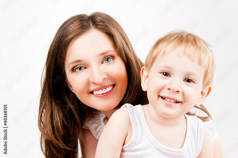 portrait of mother and child, on a gray background portrait of mother and child, on a gray background