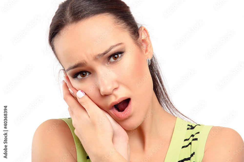 A young woman having a toothache, closeup, isolated on white A young woman having a toothache, closeup, isolated on white