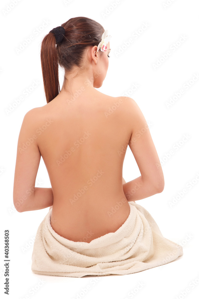 Back-view of a beautiful woman sitting on the floor Back-view of a beautiful woman sitting on the floor