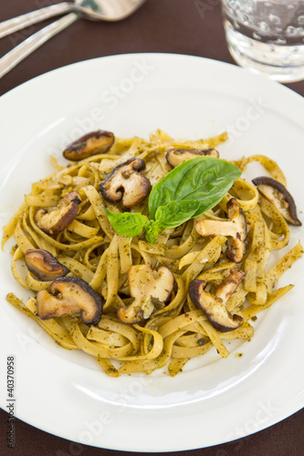 Fettuccine with mushroom in pesto sauce