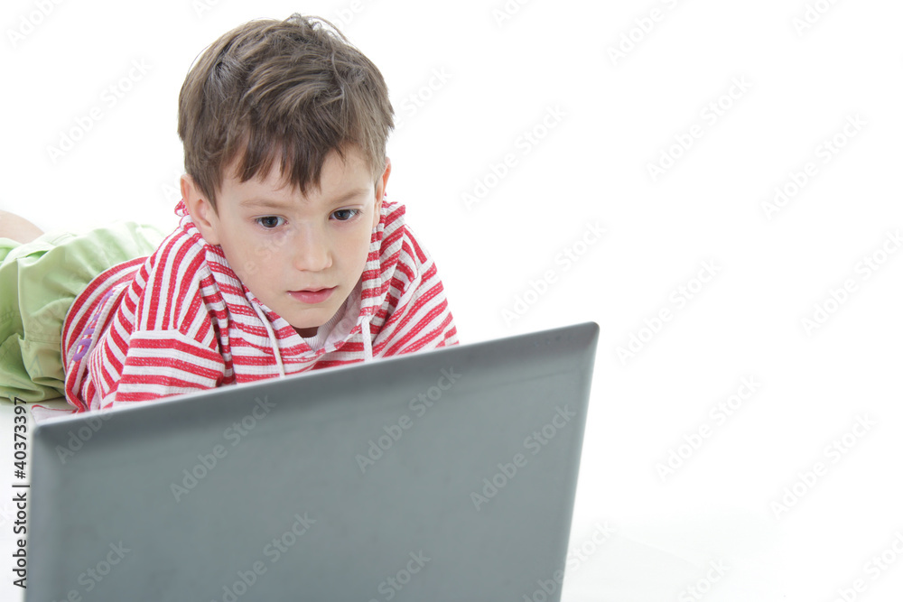 young boy with laptop over white young boy with laptop over white