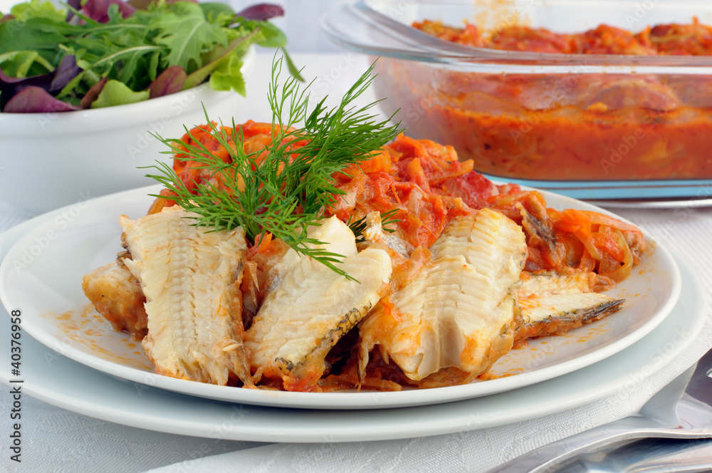 Baked fish in tomato sauce with vegetables Baked fish in tomato sauce with vegetables