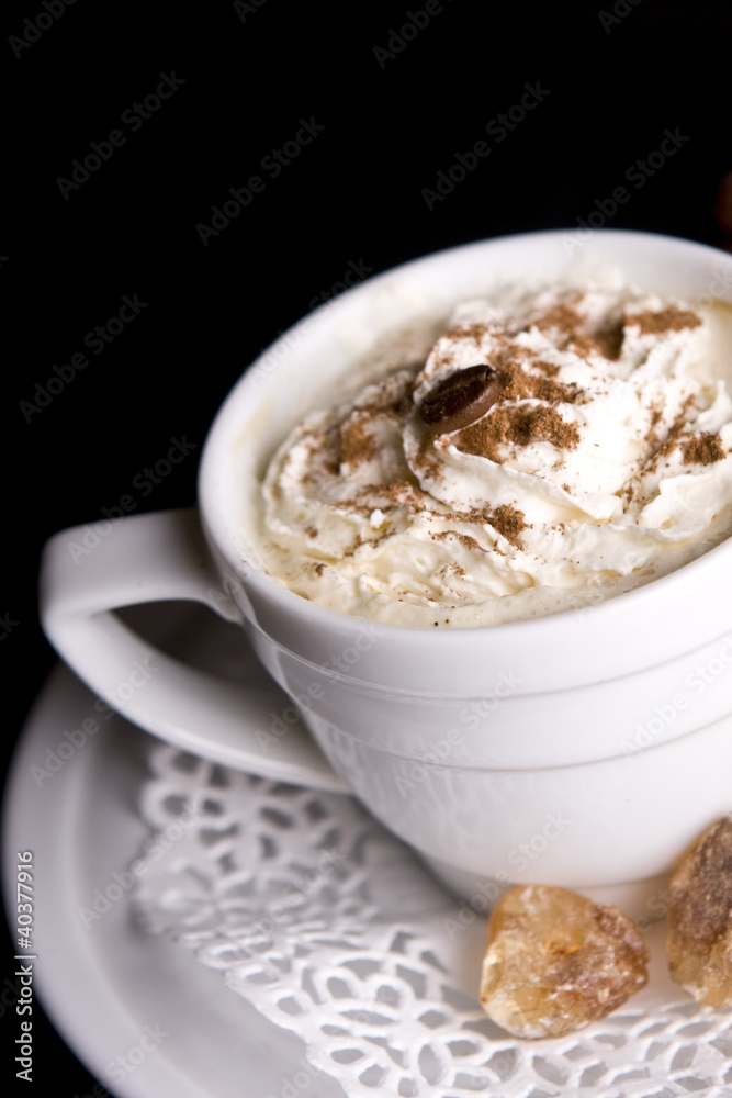Coffee background and white cup isolated in black Coffee background and white cup isolated in black