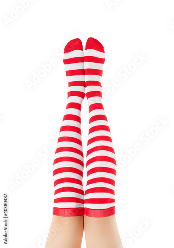 legs long female in striped socks isolated on white background