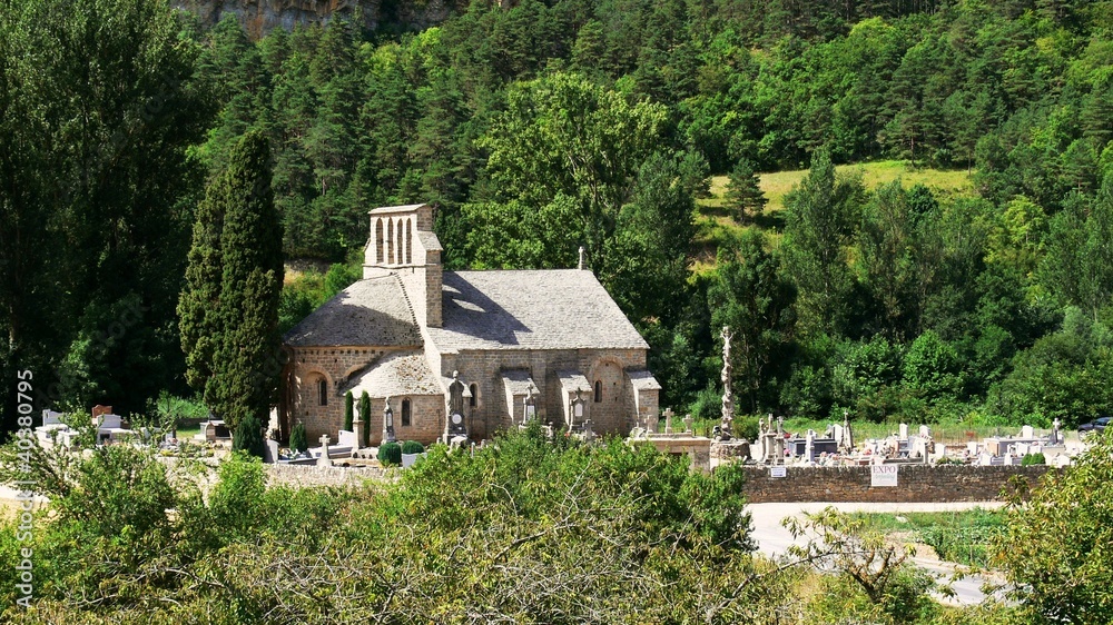 France, small Romanesque church and its cemetery in the mountain