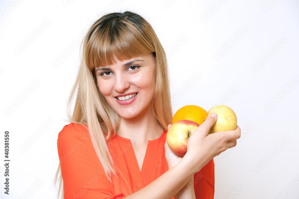 Portrait of young happy smiling woman with fruits in hand. Portrait of young happy smiling woman with fruits in hand.