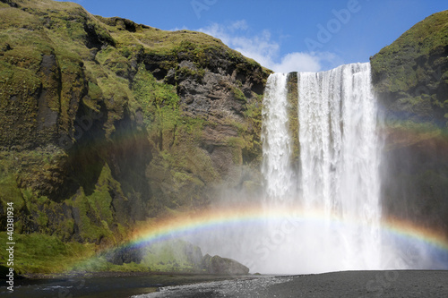 Double rainbow at waterfall Skogafoss, Iceland