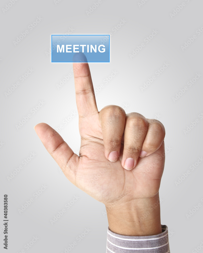 Hand pushing meeting button on touch screen Hand pushing meeting button on touch screen