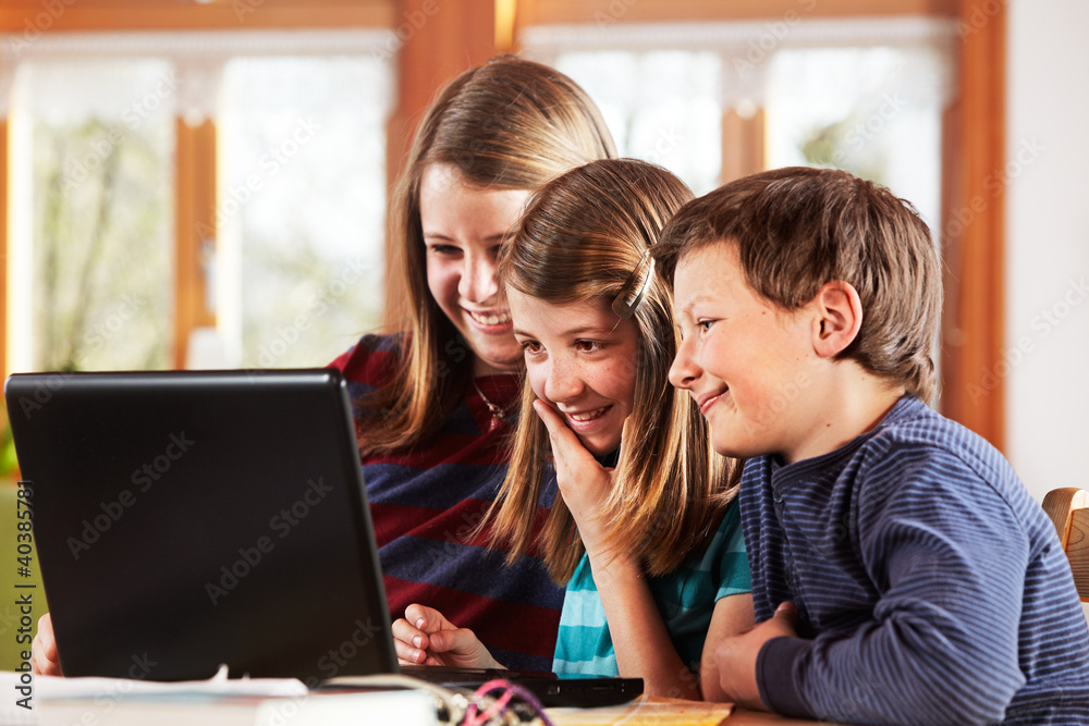 2 girls and a boy at the laptop 2 girls and a boy at the laptop