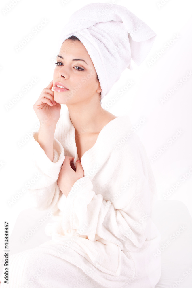 Beautiful healthy young brunette woman in a white spa bath robe Beautiful healthy young brunette woman in a white spa bath robe