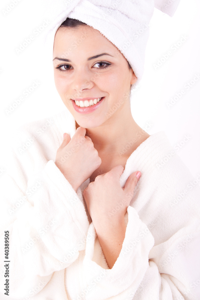 Beautiful healthy young brunette woman in a white spa bath robe