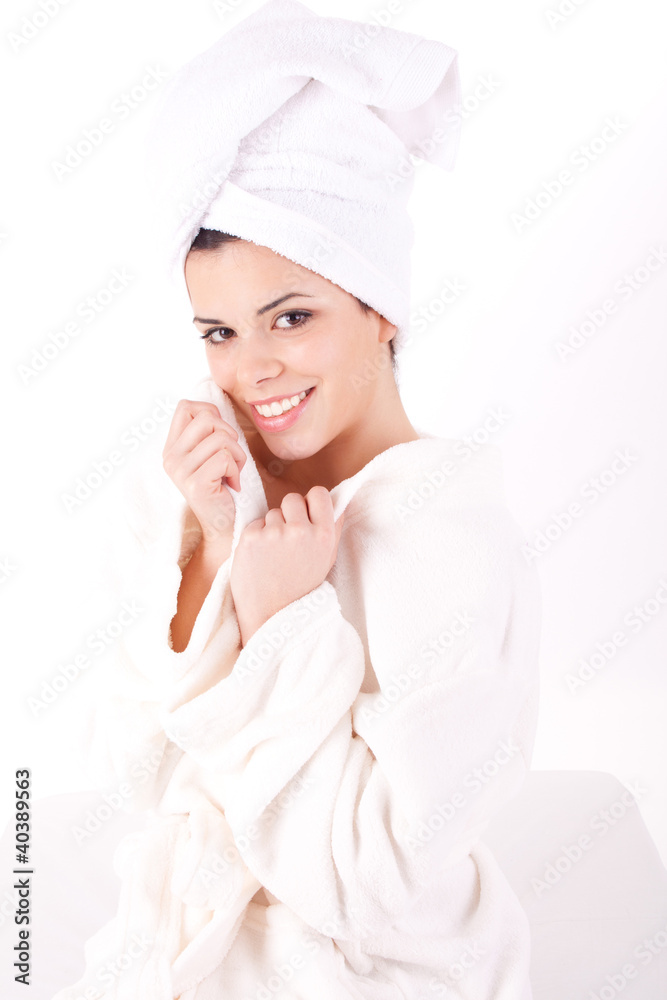 Beautiful healthy young brunette woman in a white spa bath robe Beautiful healthy young brunette woman in a white spa bath robe
