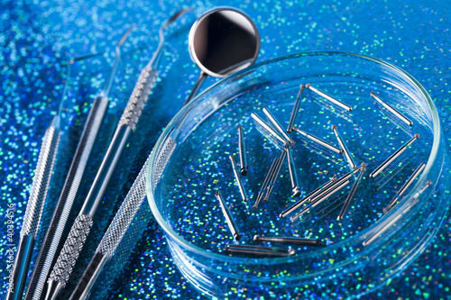 Dentist equipment on blue background photo