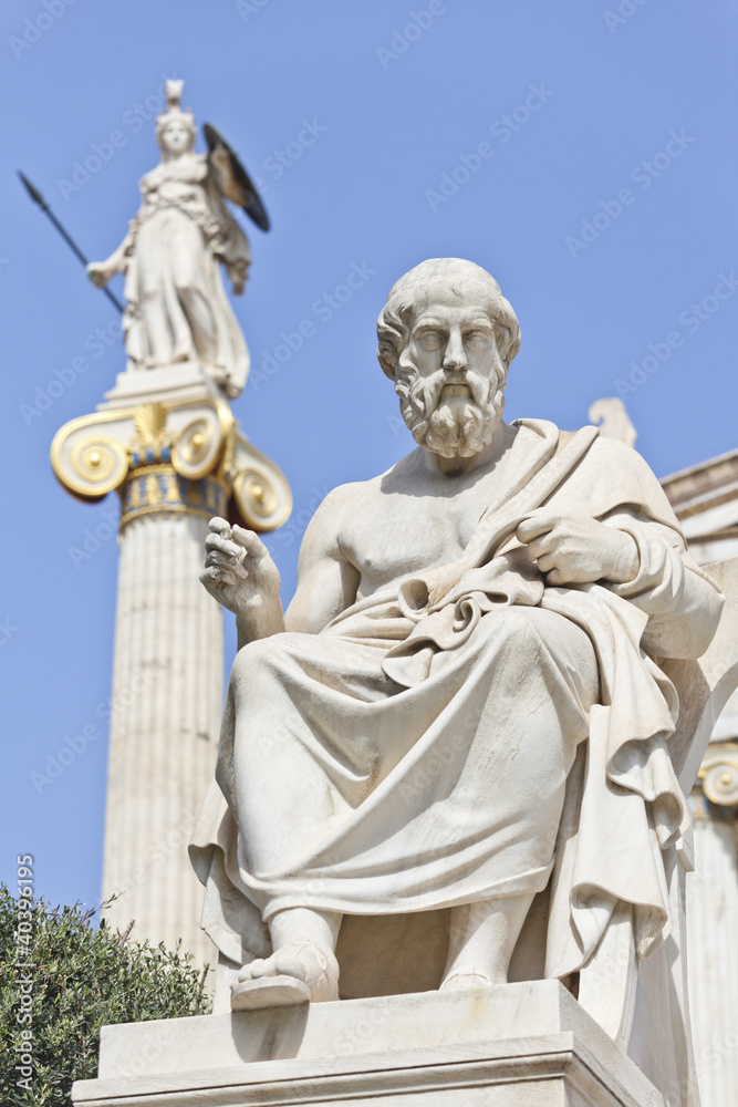 The ancient Greek philosopher Socrates with the statue of Athena in the background, Athens, Greece