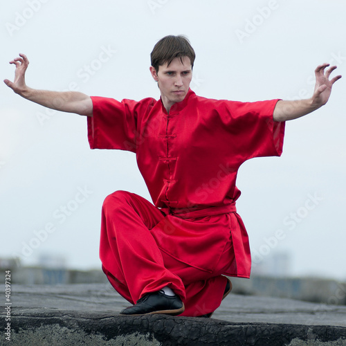 Wushoo man in red practice martial art photo